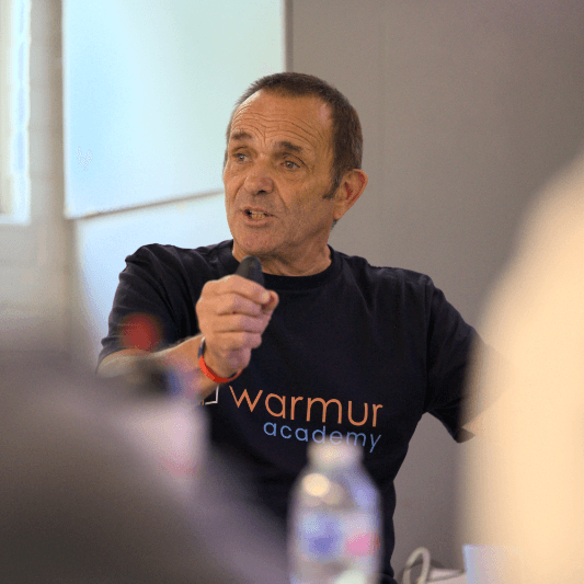 Kimbo teaching a hydronics masterclass in a Warmur Academy tee.